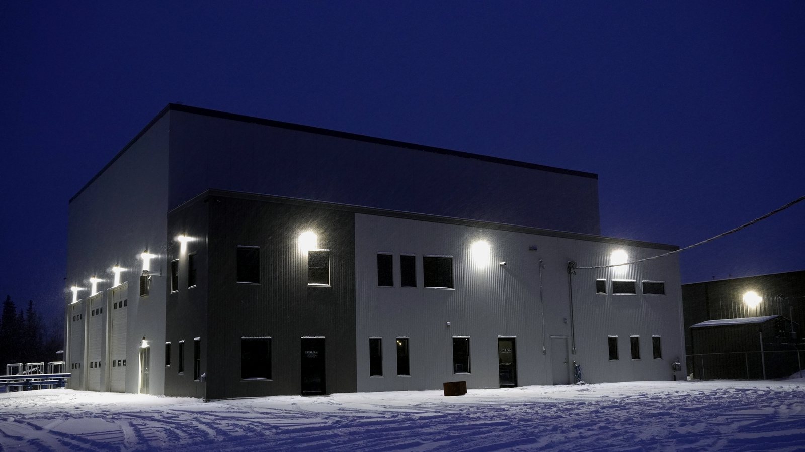 Fab All North shop building at dusk